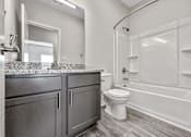 Thumbnail 5 of 42 - a bathroom with a sink and a toilet and a bath tub at Forge65, Pleasant Hill, 50327
