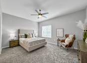 Thumbnail 5 of 57 - a bedroom with a ceiling fan and a bed at Rialto Townhomes Apartments, Waukee, IA, 50263