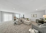 Thumbnail 7 of 57 - a living room with couches and chairs and a large window at Rialto Townhomes Apartments, Waukee, IA