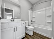 Thumbnail 25 of 57 - a bathroom with a sink toilet and shower at Rialto Townhomes Apartments, Iowa, 50263