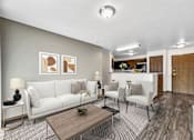 Thumbnail 2 of 33 - A living room with a white sofa, a coffee table, and a dining area in the background at Penbrooke Place Apartments, Sioux Falls, 57106
