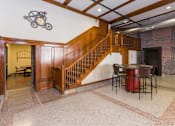 Thumbnail 13 of 13 - A room with a staircase and a fireplace.at Riverpoint Lofts, Iowa   