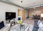 Thumbnail 2 of 31 - Living Room With Dining  at Lake Shore Apartments, Ankeny, Iowa