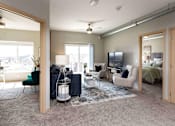 Thumbnail 4 of 31 - Living Room With TV at Lake Shore Apartments, Iowa, 50021