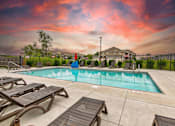 Thumbnail 25 of 31 - the pool at our apartments with tables and chairs around it at Lake Shore Apartments, Ankeny, 50021