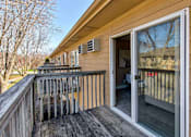 Thumbnail 19 of 22 - a porch with a sliding glass door and a deck at Lake Shore Park, Ankeny, IA