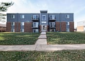 Thumbnail 11 of 13 - A large apartment complex with a grassy front yard at Lake Shore Place Apartments, Ankeny, IA,  50021