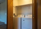 Thumbnail 9 of 12 - a laundry room with a washer and dryer in it at Sunrise Meadows, Waukee, IA, 50263