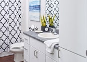 Thumbnail 7 of 31 - a white bathroom with a sink and a toilet at Vue Apartments, Iowa