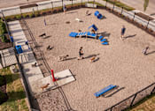 Thumbnail 29 of 31 - people and dogs in a playground at a dog park at Vue Apartments, Des Moines, IA 50309