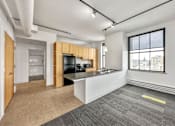 Thumbnail 8 of 50 - A spacious office with a kitchenette and a view of the city at The Des Moines Building Apartments, Des Moines, IA, 50309