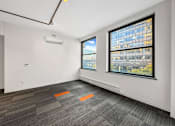 Thumbnail 30 of 50 - A room with a window and a carpet on the floor at The Des Moines Building Apartments, Iowa, 50309