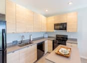 Thumbnail 18 of 26 - Fully Furnished Kitchen at Rowat Lofts, Des Moines