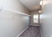 Thumbnail 13 of 32 - an empty closet with white shelves and a window at The Barclay Apartments, Altoona