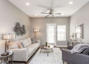 Thumbnail 12 of 32 - a living room with a couch and a ceiling fan at The Barclay Apartments, Altoona, 50009