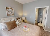 Thumbnail 10 of 32 - A bedroom with a large bed and a painting on the wall. at The Barclay Apartments, Altoona