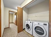 Thumbnail 14 of 22 - A laundry room with a washer and dryer.at Cornerstone Commons, Johnston Iowa  