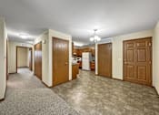 Thumbnail 5 of 22 - A kitchen area with a refrigerator, sink, and cabinets.at Cornerstone Commons, Johnston  