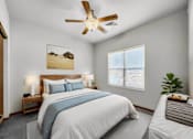 Thumbnail 4 of 22 - A bedroom with a large bed and a ceiling fan.at Cornerstone Commons, Johnston  