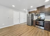 Thumbnail 4 of 26 - A kitchen with a refrigerator, oven, and stove.at Hawthorne Pointe, Bondurant, IA  