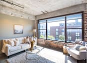 Thumbnail 6 of 39 - Living Room With Expansive Window at Clemens Building, Des Moines, Iowa