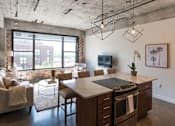 Thumbnail 11 of 39 - Living Room Come Kitchen View at Clemens Building, Des Moines, IA