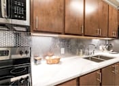 Thumbnail 14 of 39 - Kitchen Designed With Ample Storage Space at Clemens Building, Des Moines