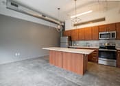 Thumbnail 16 of 39 - Modern Kitchen With Stainless Steel Appliances And Double Door Refrigerators at Clemens Building, Des Moines, IA, Iowa , 50309