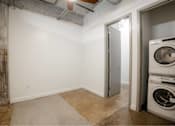 Thumbnail 23 of 39 - A laundry room with a washer and dryer at Clemens Building, Des Moines