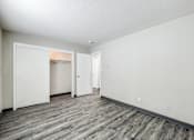 Thumbnail 20 of 21 - A room with a grey floor and white walls at The Ridges Apartments, Iowa, 50315