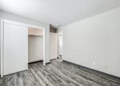 Thumbnail 19 of 21 - A room with a grey carpet and white walls at The Ridges Apartments, Des Moines, IA