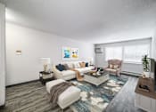 Thumbnail 1 of 21 - A living room with a white couch, a coffee table, and a television at The Ridges Apartments, Des Moines, IA,  50315