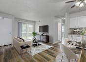 Thumbnail 2 of 18 - A modern living room with a white sofa and a glass coffee table.at Fish Creek, Norwalk  