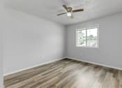 Thumbnail 10 of 18 - A room with a ceiling fan and a window.at Fish Creek, Norwalk, IA 50211  