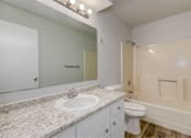 Thumbnail 16 of 18 - A bathroom with a sink, toilet, and bathtub.at Fish Creek, Norwalk, 50211  