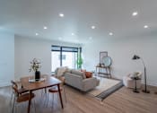 Thumbnail 5 of 30 - a living room with a couch and a table  at Matilda 235 Townhomes, Des Moines, 50309