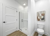 Thumbnail 18 of 30 - a bathroom with a toilet and a shower at Matilda 235 Townhomes, Des Moines