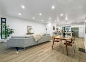 Thumbnail 7 of 30 - a living room with a couch and a table at Matilda 235 Townhomes, Des Moines, 50309