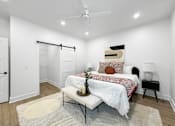 Thumbnail 2 of 30 - a bedroom with a bed and a closet at Matilda 235 Townhomes, Iowa