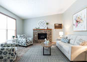Thumbnail 10 of 33 - Living Area With Fireplace at Creekstone Falls, South Dakota