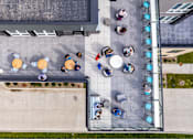 Thumbnail 12 of 53 - A group of people are sitting in a circle on a patio.at Level, Des Moines, IA  