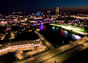 Thumbnail 14 of 53 - A cityscape at night with a river running through it.at Level, Des Moines, IA 50309  