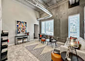 Thumbnail 28 of 53 - A living room with a large painting on the wall and a striped rug on the floor.at Level, Iowa, 50309