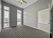 Thumbnail 33 of 53 - A room with a ceiling fan and carpeted floor.at Level, Des Moines, IA 50309  