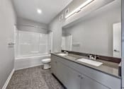 Thumbnail 40 of 53 - A bathroom with a toilet, sink, and shower.at Level, Des Moines, 50309  