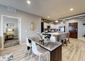 Thumbnail 3 of 34 - a dining room and kitchen with a table and chairs at Linc, Des Moines  