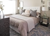 Thumbnail 6 of 34 - a bedroom with a bed and pillows at Linc, Des Moines  