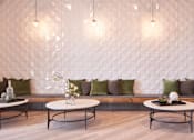 Thumbnail 14 of 34 - a seating area with tables and pillows at Linc, Des Moines  