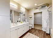 Thumbnail 20 of 34 - a bathroom with a sink and a toilet and a shower at Linc, Des Moines, 50309  