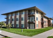 Thumbnail 17 of 20 - Building with balconies and a sidewalk at Cedarbrooke Place , Norwalk, IA, Iowa , 50211